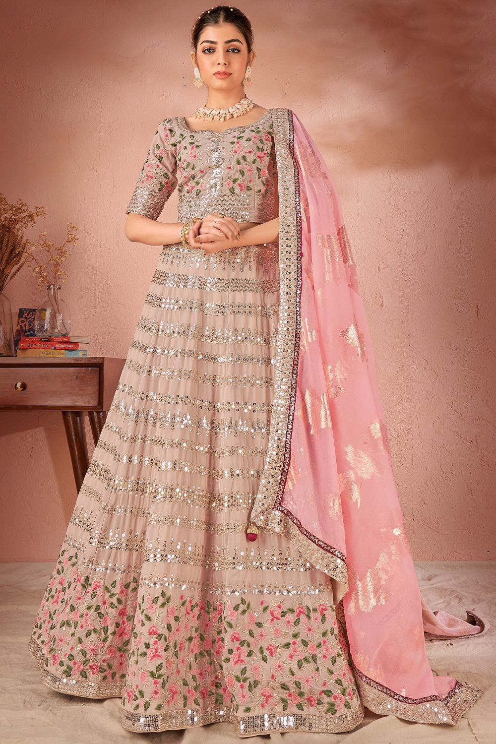 Pinkish Beige Lehenga Choli With Butti Work in Net